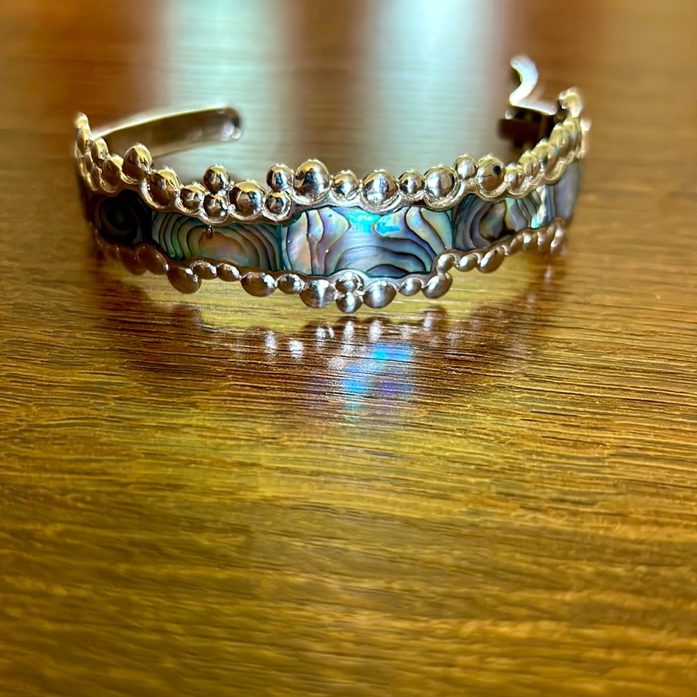 Cuff bracelet with shell design